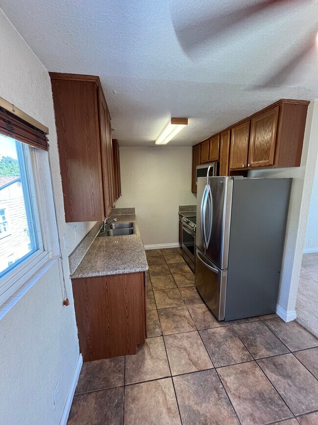 Kitchen with recent LG stainless steel appliance store - 5310 Rex Ave