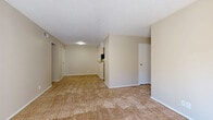 Located at 8711 Cinnamon Creek Dr in San Antonio, TX, this one-bedroom, one-bathroom unit offers a well-organized single-floor layout designed for comfortable everyday living. The open-concept living and dining area is spacious and bright, featuring neutral beige carpet, textured ceilings, and large windows that invite natural light. A ceiling fan in the living area adds both function and comfort. The kitchen is thoughtfully appointed with warm wood-toned cabinetry, laminate countertops, a double-basin sink, a dishwasher, and durable wood-look tile flooring. An adjacent pantry provides generous storage space. The dining area flows naturally from the kitchen, creating a cohesive layout ideal for daily use. The bedroom is a well-proportioned retreat with plush carpeting, a ceiling fan with light fixture, and a window with blinds. It connects to a walk-in closet equipped with wire shelving for ample storage. The full bathroom features a tiled tub/shower combo, wood-look flooring, and a vanity with wooden cabinetry. Additional highlights include an in-unit laundry area and a private balcony, offering outdoor space for relaxation. The overall palette of warm neutrals throughout creates a clean, move-in-ready atmosphere.