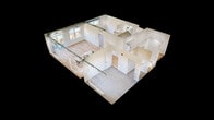 Located at 201 8th Ave NW in Austin, MN, this contemporary single-floor apartment offers 1,060 square feet of thoughtfully designed living space across 3 bedrooms and 2 bathrooms. The open-concept kitchen and living area is a standout, featuring light hardwood flooring, exposed industrial-style ductwork, and an abundance of natural light from large windows with urban views. The kitchen is appointed with two-tone dark and white shaker cabinetry, striking marble-look quartz countertops, stainless steel appliances, a built-in island with an undermount sink, and modern pendant lighting. The living area flows seamlessly to a private balcony. Both bathrooms continue the modern aesthetic with dark-finish vanities, white quartz countertops, and hardwood-style flooring; the primary bath includes a walk-in shower. The three bedrooms feature plush neutral carpet and generous windows that invite natural light and neighborhood views. The primary bedroom spans 190 square feet and includes a dedicated closet with built-in racking. Two hallways and an additional closet provide practical storage and connectivity throughout the unit. The overall design blends industrial and contemporary elements for a clean, modern ambiance.