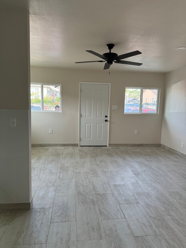 Left side living room. Kitchen to living room. - 3872 Percy St