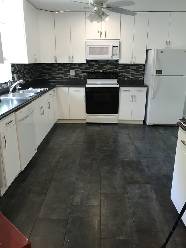 Open Kitchen with new tile, counters, backsplash, paint - 10160 Plant Dr