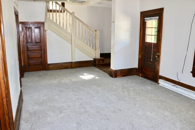 Living room/front door - 303 W Pleasant St