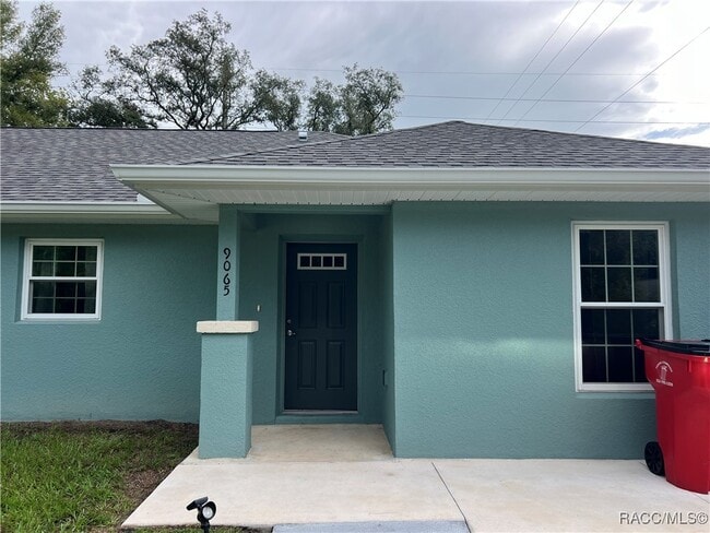 Building Photo - 9065 N Travis Dr