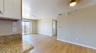 Located at 1379 27th St in San Diego, CA, this single-floor unit offers a well-designed layout with a clean, neutral aesthetic throughout. The open living area is finished with light wood laminate flooring and features a ceiling fan, creating a bright and airy atmosphere. A sliding glass door leads to a private outdoor balcony, allowing natural light to fill the space. The kitchen is thoughtfully appointed with white shaker-style cabinetry, granite countertops, stainless steel appliances including a refrigerator with ice and water dispenser and an electric range, and a stainless steel sink — all set over matching wood laminate flooring. The bedrooms offer plush carpeting underfoot, ceiling fans, and window blinds that provide both comfort and privacy. Each bedroom includes a closet with mirrored sliding doors for efficient storage. The bathroom features warm diagonal tile flooring, white cabinetry with granite countertops, and a clean, functional layout. Throughout the unit, neutral beige-toned walls and white baseboards contribute to a cohesive, move-in-ready appearance. The space combines practical design with comfortable finishes, making it a well-rounded and inviting home.