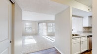 Located at 2300 Link Side Dr in Cincinnati, Ohio, this single-floor residence offers a well-organized layout filled with natural light throughout. The open living area features plush carpeting, a textured ceiling, and multiple windows alongside a sliding glass door that floods the space with sunlight and provides access to the outdoors. A ceiling fan with a light fixture enhances comfort in the generously sized main living space.

The kitchen is thoughtfully appointed with white cabinetry, granite-style countertops, stainless steel appliances including a refrigerator and dishwasher, and durable wood-look vinyl flooring, giving it a clean, modern aesthetic. A galley-style layout maximizes functionality and flow.

The bedrooms are spacious and carpeted, each benefiting from multiple windows dressed with horizontal blinds that allow for abundant natural light. Closet space is well provided, and ceiling fans are featured for added comfort.

The bathroom includes wood-look vinyl flooring, a combination tub and shower, and a distinctive octagonal window that introduces natural light while maintaining privacy. A dedicated laundry area with in-unit washer and dryer connections adds everyday convenience. Neutral wall tones and consistent finishes throughout the home create a cohesive, inviting atmosphere.