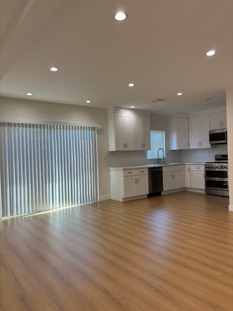 kitchen area leading to back - 4508 Kingswell Ave