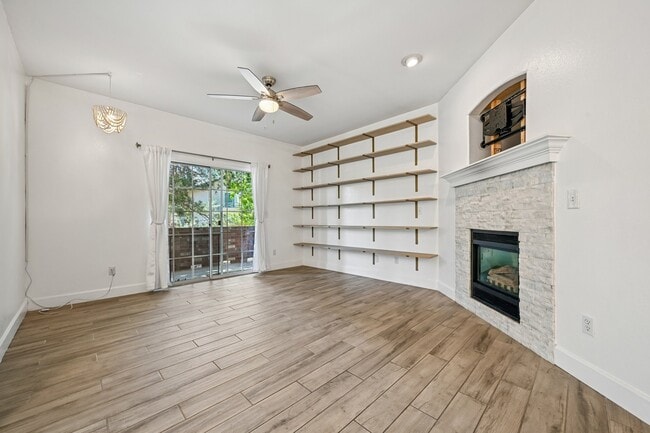 Living room with gas fireplace, bookshelves and tv mount ready - 8747 E Dry Creek Rd