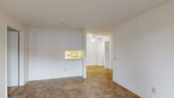 Located at 1056 Weldon Ln in Bay Point, CA, this single-floor, 2-bedroom, 2-bathroom home offers a practical and well-organized layout. The entrance opens to a spacious living area finished with neutral tile flooring and a ceiling fan overhead. A pass-through window connects the living space to the galley-style kitchen, which features white cabinetry, light countertops, a gas range, and ample storage above and below. The kitchen also provides a clear view of the in-unit laundry area, conveniently tucked behind bi-fold doors. The living room includes a sliding glass door that opens to an outdoor area, bringing in natural light. Both bedrooms are carpeted and well-sized, with the primary bedroom featuring a walk-in closet with built-in shelving and a window with natural light. The second bedroom offers a quiet, comfortable layout with its own carpeting. The two bathrooms are finished with tile flooring and white fixtures; one includes a vanity with under-cabinet storage, a wall mirror with overhead lighting, and a bathtub. A utility panel is also accessible within the home. This residence combines functionality with a clean, neutral aesthetic throughout.