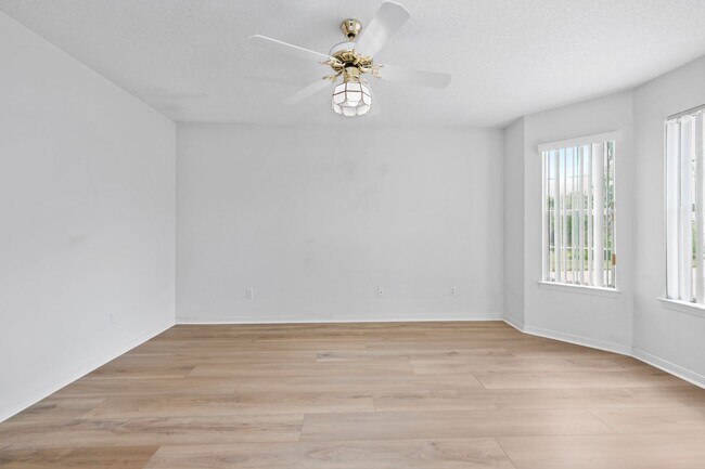 Building Photo - Spacious 3BR Retreat with Soaring Ceilings & Screened Porch