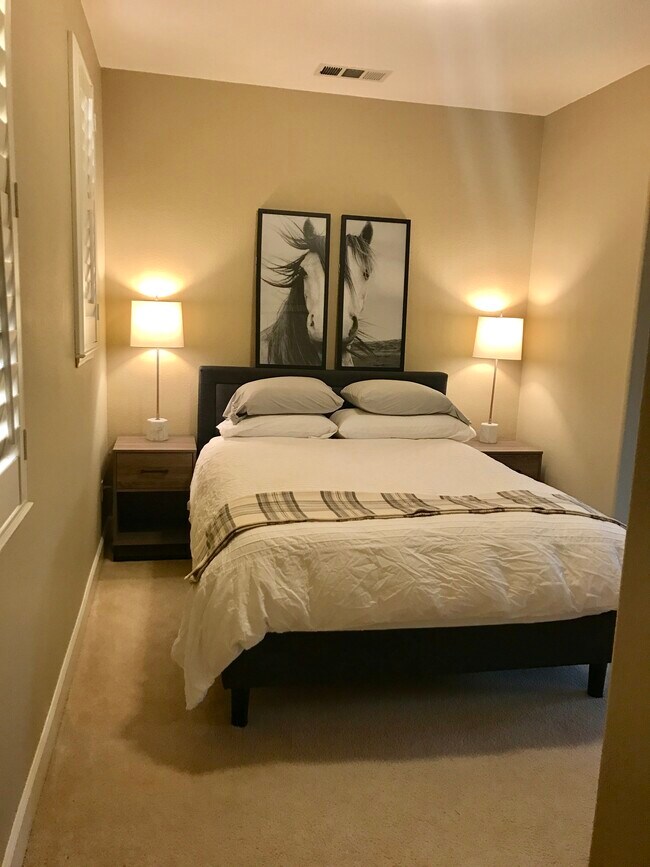 Overview of the bedroom. The Queen bed has a very comfortable mattress from Brentwood Home that is made in the USA of eco friendly materials. Bedding is provided if requested. Nightstands and lamps complete your oasis. - 248 Buttercup Ct
