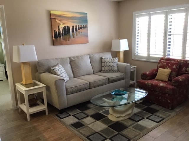 light filled living room plantation shutters - 4345 27th Ct SW