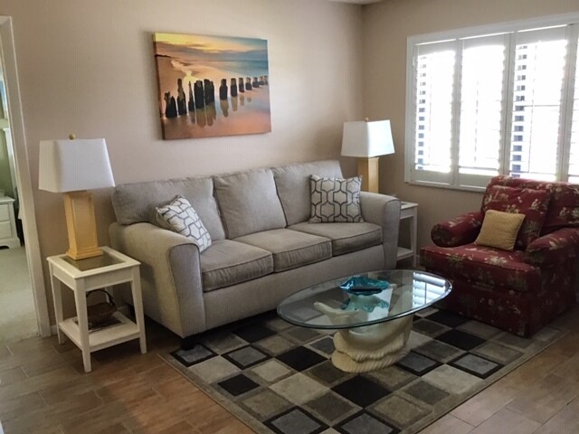 light filled living room plantation shutters - 4345 27th Ct SW