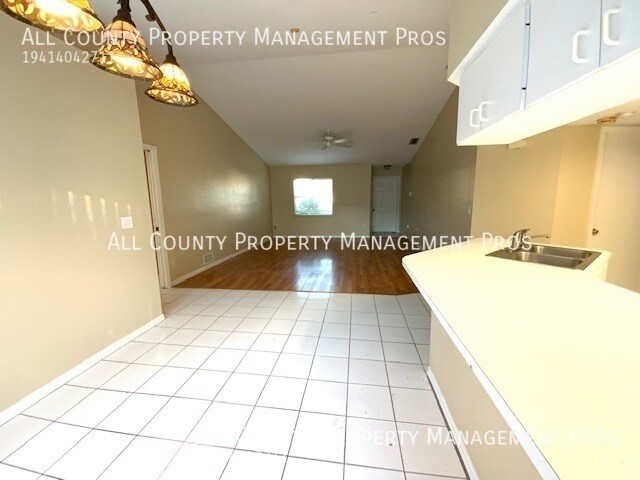 Building Photo - 3/2 with 2 car garage and partially fenced...