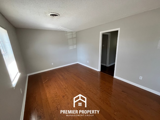 Photo - Charming 3BR Home in 38118 | Hardwood Floors & Spacious Fenced Backyard