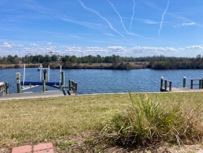 Building Photo - Waterfront condo with community pool!
