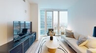 Located on the 16th floor at 55 Clinton Place in New Rochelle, NY, this thoughtfully designed one-bedroom, one-bathroom residence offers a clean, modern aesthetic with an efficient and well-organized layout. Light hardwood flooring runs throughout, complementing the crisp white walls and creating a warm, contemporary atmosphere.

The living room is a standout space, anchored by expansive floor-to-ceiling windows that frame sweeping panoramic views of the New Rochelle skyline and beyond, flooding the room with natural light. The bedroom mirrors this design, featuring the same dramatic window wall and generous views, offering a serene, light-filled retreat.

The kitchen is well-appointed with warm wood cabinetry, stone countertops, stainless steel appliances including a gas range, refrigerator, and microwave, along with a deep undermount sink and pendant lighting. It opens naturally toward the dining area, making it ideal for everyday living.

The bathroom features a clean, modern design with large-format dark tile flooring, a glass-enclosed walk-in shower, wood-accented vanity, and brushed nickel fixtures. A hallway with recessed lighting connects the rooms, and the unit also includes two closets and an in-unit laundry, providing practical storage and convenience throughout.