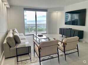 Building Photo - 10275 Collins Ave