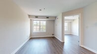 Located at 5816 Westpark Drive in Charlotte, NC, this one-bedroom, one-bathroom unit offers a thoughtfully designed single-level layout that maximizes every square foot. Hardwood-style flooring runs consistently throughout the space, lending a clean, cohesive look to each room.

The open kitchen and living area serve as the heart of the unit. The kitchen is well-appointed with white cabinetry, granite-style countertops, stainless steel appliances including a refrigerator, gas range, and dishwasher, providing a functional and attractive cooking space that flows naturally into the living area.

The bedroom is a comfortable, well-proportioned room featuring large grid-pane windows that fill the space with natural light and offer views of the surrounding tree-lined neighborhood. The room includes a closet for storage and is served by a dedicated bathroom.

The bathroom is finished with granite-topped white vanity cabinetry and includes a full shower-tub combination, offering practical amenities in a clean, neutral palette.

Throughout the unit, neutral warm-toned walls, white trim, and consistent flooring create a bright, inviting atmosphere. The space is designed for efficient, comfortable living, making it a practical option in the Westpark Drive corridor of Charlotte.