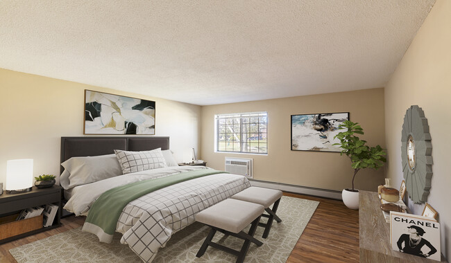 Large bedroom with wood flooring and ample natural light - Royal Crest Marlboro Apartment Homes