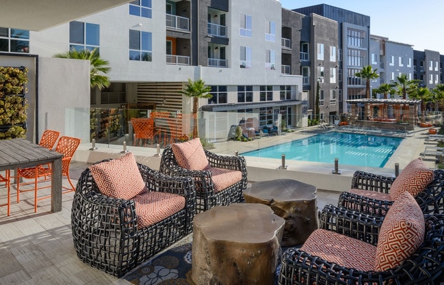 Resort-style pools and spas with comfortable seating - Vantis Apartments
