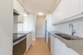 Located at 955 Warwick Crt in Burlington, Ontario, this 2-bedroom, 1-bathroom unit offers a clean, modern layout with a bright and airy atmosphere throughout. Light hardwood-style flooring runs continuously across all rooms, complementing the neutral grey-toned walls and white trim for a cohesive, contemporary look.

The spacious living room is a standout feature, anchored by large floor-to-ceiling sliding windows and balcony access that frame expansive outdoor views and flood the space with natural light. The galley-style kitchen is well-appointed with white cabinetry, grey countertops, a white subway tile backsplash, stainless steel appliances including an electric range and dishwasher, and a double undermount sink — offering both style and functionality.

Both bedrooms are comfortably sized and feature sliding panel built-in closets and large windows that bring in generous natural light. The primary bedroom is particularly spacious, with room for a full bedroom suite. The full bathroom is finished with light tile flooring, a tub-shower combination with white tile surround, a vanity with storage, and a large mirror.

A practical hallway connects the main living areas, and the unit's efficient layout makes excellent use of the available space throughout.