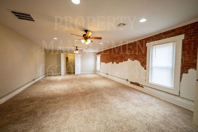 Building Photo - Beautifully Restored Downtown Caney, KS Apartment