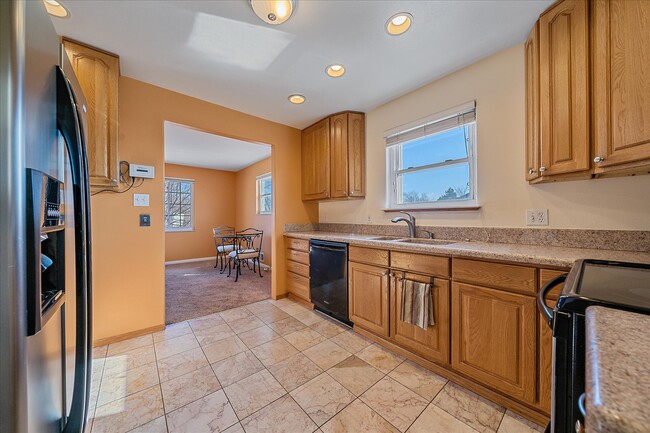 Kitchen with granite counters - 2040 E 114th Pl