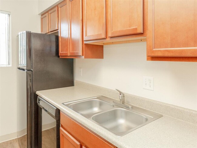 Stainless Steel Sink With Faucet In Kitchen - Cimarron Place Apartments