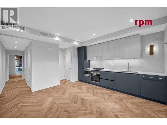 Photo du bâtiment - 775-775 W 49th Ave