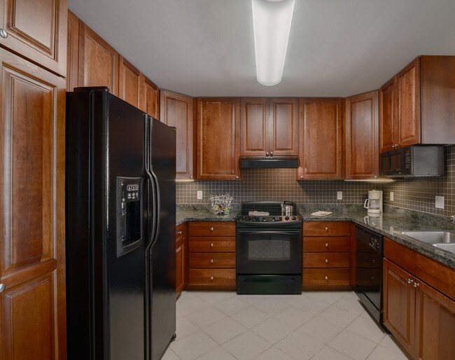 Granite counters, ample storage, and full appl - Broadway Plaza - Mayo Clinic