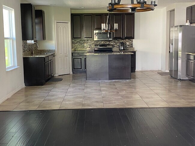 Tile floor on the Kitchen and Dinning Room - 4702 Doyle Dr