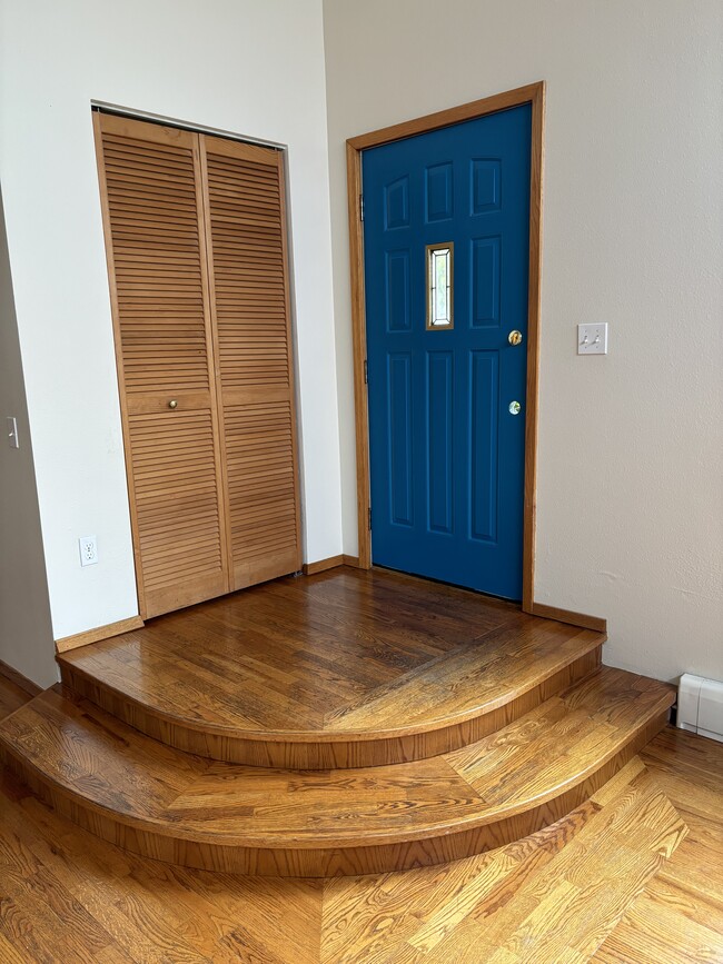 inside front door entrance with coat closet - 704 Gladstone St