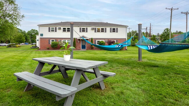 Take a break between studies to soak up the sun and relax in our hammock garden at Aspen Chase. This peaceful oasis is the perfect place to escape the hustle and bustle of campus life. - Aspen Chase