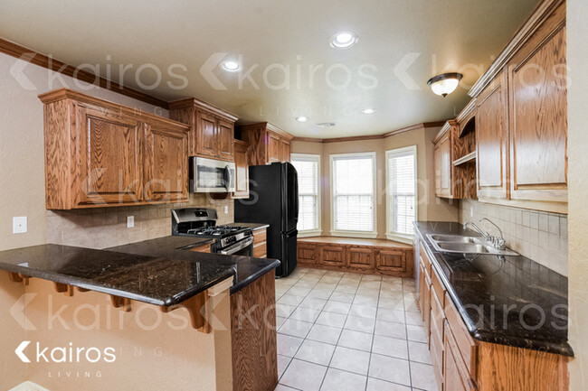 Foto del edificio - 8611 Garden Way Dr