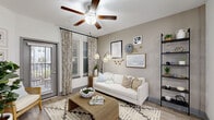 This thoughtfully designed one-bedroom, one-bathroom residence in Longwood, Florida offers a modern, open-concept layout with stylish finishes throughout. Light wood-look flooring extends across the main living areas, creating a cohesive and airy feel. The kitchen and living room share a seamless open floor plan, anchored by a large center island with granite countertops and bar seating for multiple guests. The kitchen is well-appointed with white shaker cabinetry, open shelving, a subway tile backsplash, and a full suite of stainless steel appliances. Pendant lighting and recessed fixtures illuminate the space beautifully. The living area features a ceiling fan, large windows with patio door access, and abundant natural light. The spacious primary bedroom includes plush carpet, vaulted ceilings, and direct access to both the full bathroom and a generous walk-in closet fitted with multi-level wire shelving. The bathroom offers a full soaking tub and shower combo with tile surround, a granite-topped vanity, and white cabinetry. Additional highlights include a dedicated laundry area, a hallway for added privacy, and a private patio. This residence combines practical functionality with clean, contemporary design.