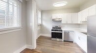Located at 2000-2006 W Fargo Ave in Chicago's Rogers Park neighborhood, Unit 4W is a 2-bedroom, 1-bathroom residence that blends classic Chicago architectural character with clean, updated finishes. Rich hardwood floors run throughout the entire unit, complemented by soft gray walls, crisp white trim, and elegant crown molding that add a refined touch to each room.

The two bedrooms are well-proportioned, each featuring classic cast-iron radiators and windows fitted with blinds that invite natural light while maintaining privacy. The primary bedroom offers generous space, a double-door closet, and direct access to the hallway. The second bedroom mirrors this warmth with its own window and radiator.

The kitchen is efficiently designed with white shaker-style cabinetry, stainless steel gas range, dishwasher, and wood-look flooring. A charming entry door with a mesh glass panel and flanking windows provides a bright, welcoming transition into the unit.

The bathroom is cleanly finished with a tub-shower combo, white vanity, wood-look flooring, and a window for natural ventilation. Two hallways connect the rooms with ease, creating a logical and functional floor plan. Overall, the unit offers a cohesive, move-in-ready aesthetic with timeless details throughout.