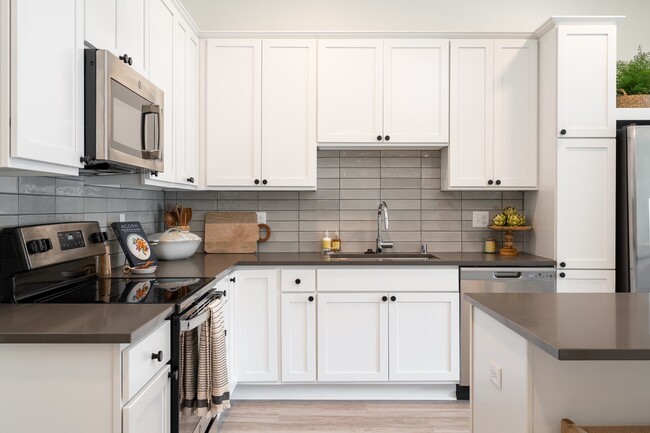 You'll love our thoughtfully designed kitchens with ample cabinetry and counter space. - The Rowan