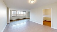 This contemporary 1-bedroom apartment in Toronto offers a well-designed living space of 62 square meters. The open-concept layout maximizes the use of space, creating a seamless flow between the living area and kitchen. Large windows dominate one wall, flooding the space with natural light and providing panoramic city views.

The living area features sleek laminate flooring and is illuminated by a modern circular ceiling light. The kitchen, while compact, is efficiently designed with white cabinetry, stainless steel appliances, and quartz countertops. It includes a window that allows for additional natural light and ventilation.

The bedroom, measuring 16 square meters, offers ample space and includes a sliding door closet for storage. The bathroom is pristine, with white tiled walls, a bathtub-shower combination, and modern fixtures.

Throughout the apartment, the color palette is predominantly white, creating a bright and airy atmosphere. The space is further enhanced by recessed lighting and baseboard heating units. The apartment's single floor layout and thoughtful design make it an ideal urban dwelling, balancing comfort and functionality in the heart of Toronto.