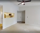 This 650 square foot apartment in Winston-Salem, NC, offers a thoughtful layout that maximizes space efficiency. The single-floor design includes one bedroom, measuring 170 square feet, and one bathroom. The open-concept living area combines the kitchen and living room, creating a sense of spaciousness.

The kitchen boasts modern appliances, including a stainless steel refrigerator and oven, complemented by white cabinetry and subway tile backsplash. A pass-through window connects the kitchen to the living area, enhancing the flow between spaces.

The bathroom features a clean, contemporary design with a white vanity, large mirror, and a shower-tub combination. Light wood flooring in the bathroom and kitchen contrasts nicely with the neutral-toned carpeting found in the bedroom and living areas.

Large windows throughout the apartment provide ample natural light, while ceiling fans offer air circulation. The neutral color palette of whites and light grays creates a bright, airy ambiance that can easily accommodate various decor styles.

Storage solutions include a dedicated closet and built-in kitchen cabinetry. The apartment's layout and features make efficient use of the 650 square feet, offering a comfortable living space in a compact footprint.