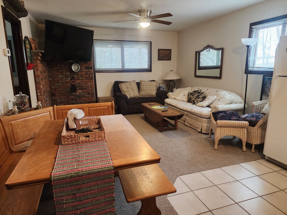 Cozy living area, bright, with plenty of natural light. 65 inch flat screen smart TV with Roku - 19 Overbrook Dr