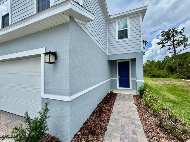 Building Photo - Brand-New 4BR Home with Tile Floors & Quar...