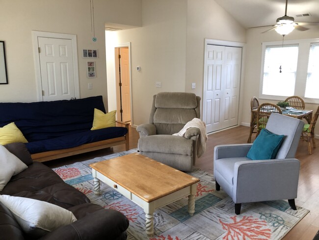 view of living room, dining room, laundry room - 722 George Howe St