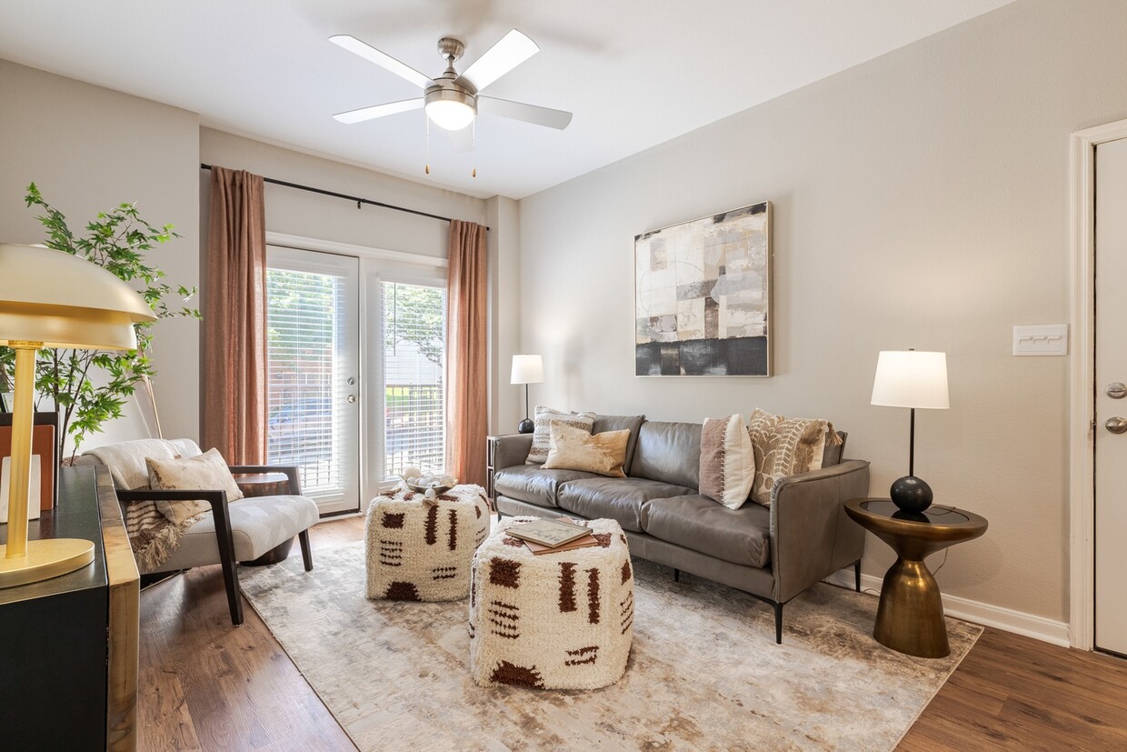 Newly Renovated Living Room with Hardwood-Style Flooring - Deep Deuce at Bricktown Apartments