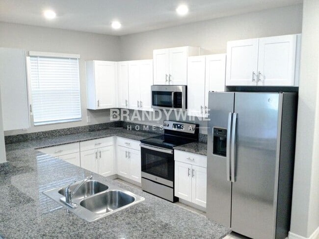 Building Photo - COMING SOON!! BELMONT TOWNHOMES!! 4 bedroo...