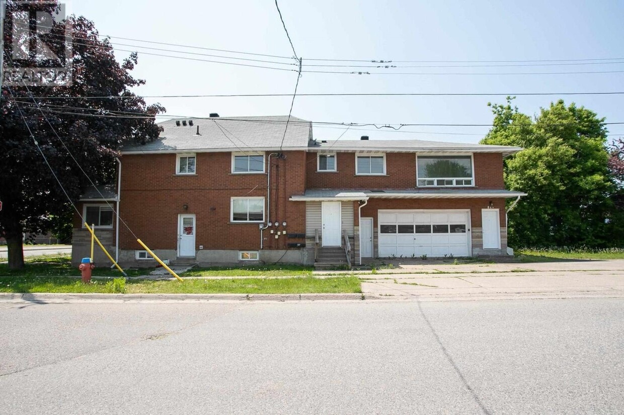 Primary Photo - 2 Bedroom Upper-Level Unit – Parking & In-...