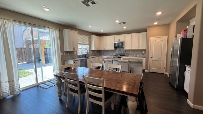 Building Photo - Spacious 5-Bedroom Home | Private Yard + Attached Garage