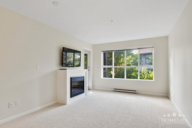 Building Photo - Introducing a charming 2 bed, 2 bath condo with a spacious patio fit for entertaining -  Located ...