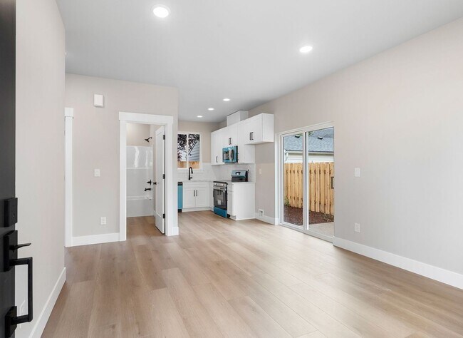 Building Photo - Brand-New Detached 2 Bedroom Home with Private Fenced Yard and Designer Finishes