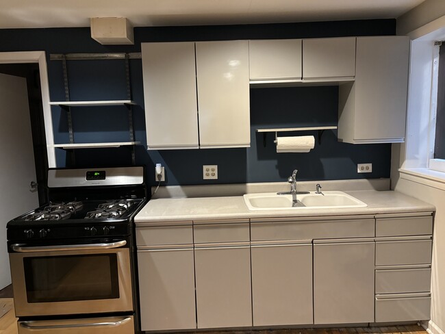 Kitchen area with gas range. - 3343 N Hoyne Ave