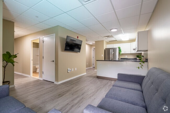 3BR, 1BA - Living/Dining Room - University Towers - UofM Student Housing Apartments